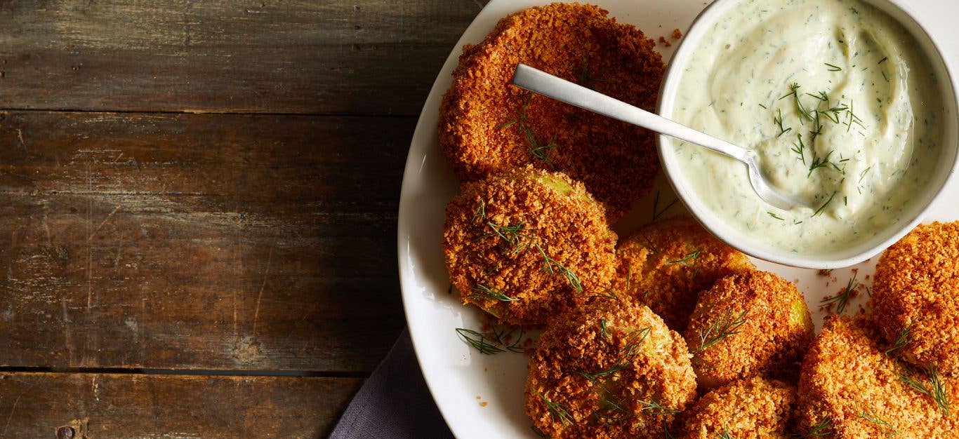 Air-Fried Green Tomatoes on a white plate with dipping sauce