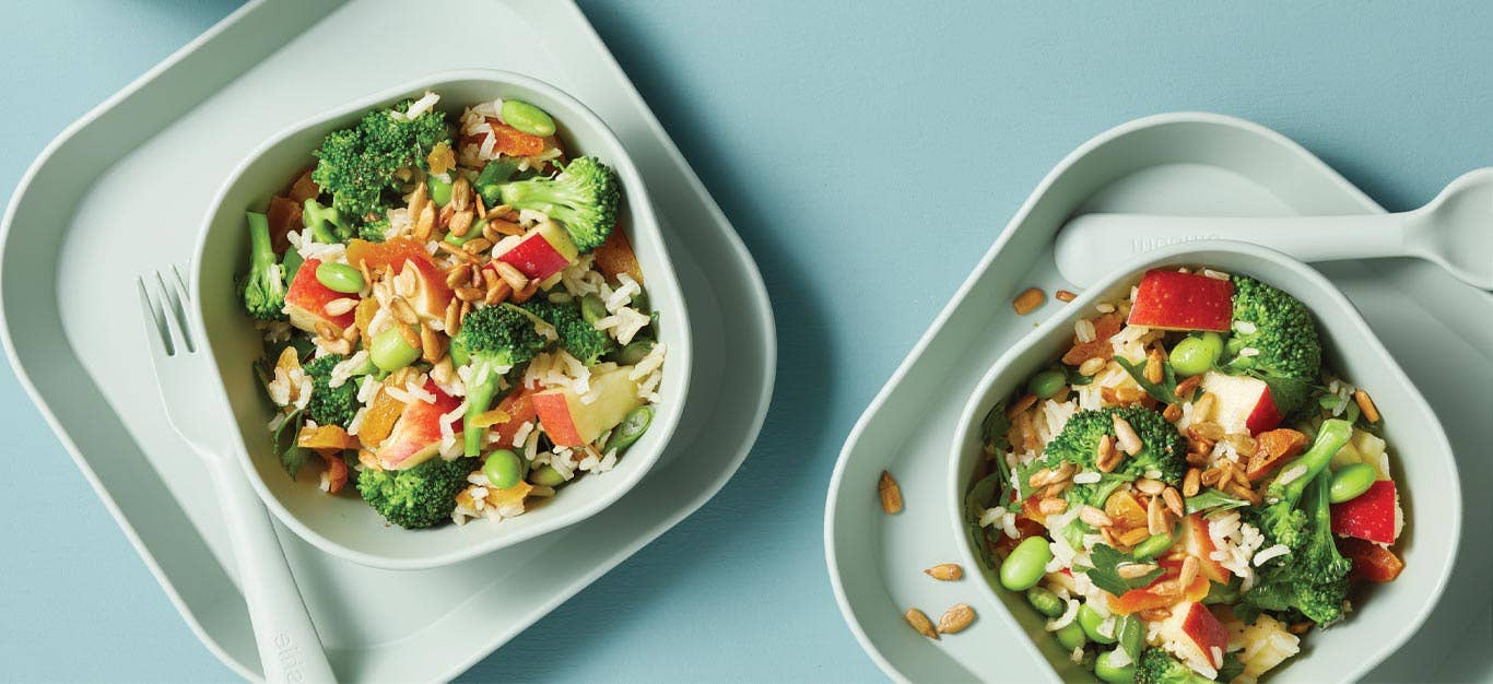 Kid-Friendly Chopped Salad in white plastic bowls with plastic utensils on a blue background