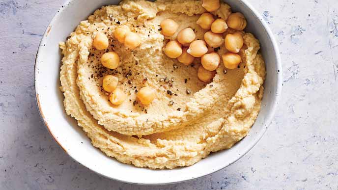 Hummus Base Recipe in a white ceramic bowl