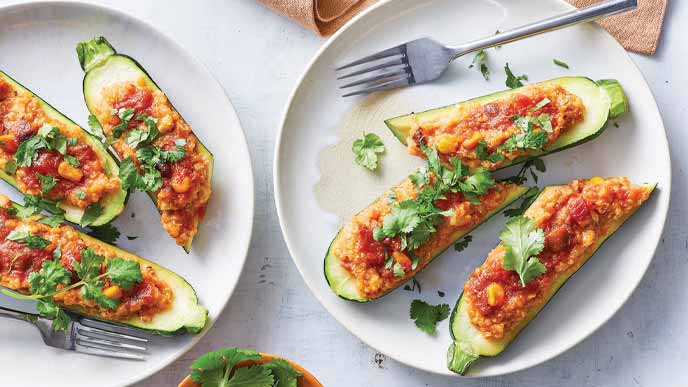 Easy Stuffed Zucchini Boats on white plates