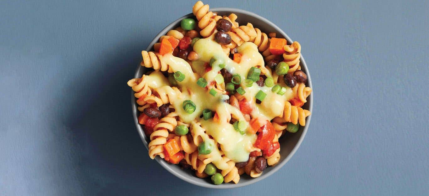 Creamy Vegan Chili Mac in a bowl against a light gray background