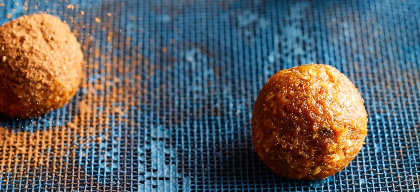 Mexican Chocolate Energy Bites on a blue wood tabletop