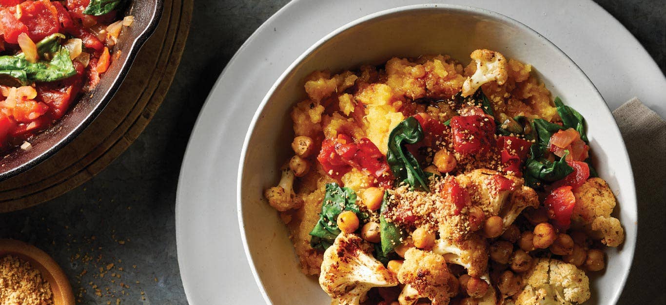 Mashed Rutabaga with Italian Roasted Cauliflower and Chickpeas in a white ceramic bowl