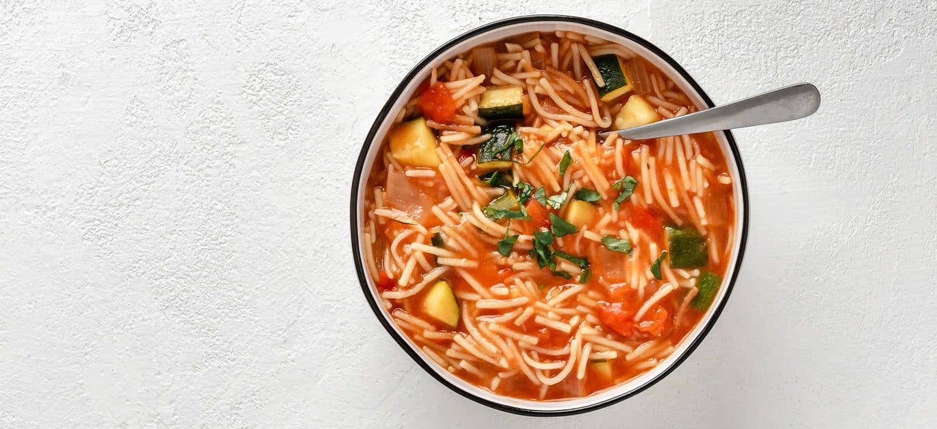 Toni Okamoto’s Sopa de Fideo in a white bowl against a gray background